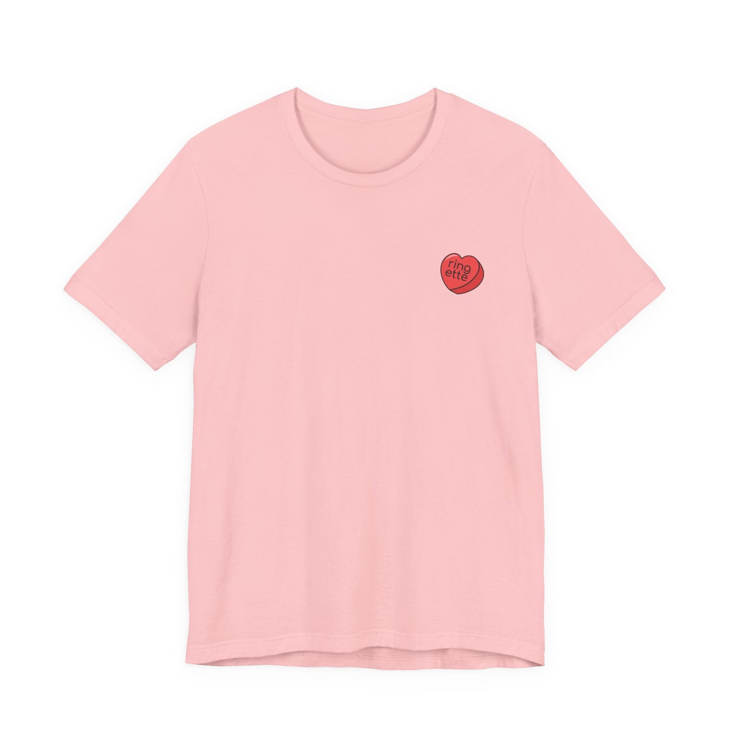 Pink t-shirt with a small red heart-shaped logo and 'ringette' text on a white background