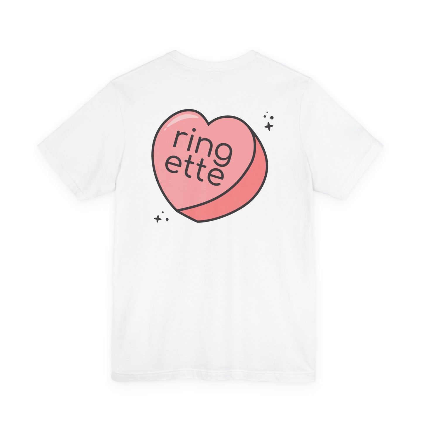 White t-shirt with a large pink heart-shaped logo and 'ringette' text on a white background